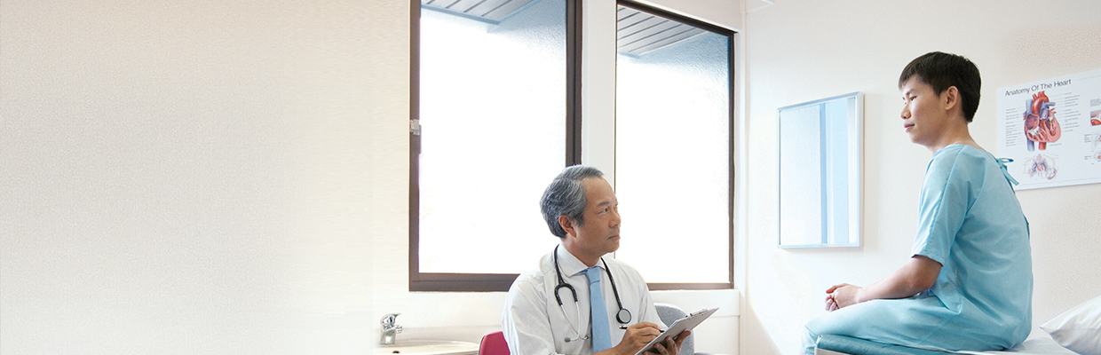 A doctor is discussing medical record with patient; image used for HSBC Early Critical Care.