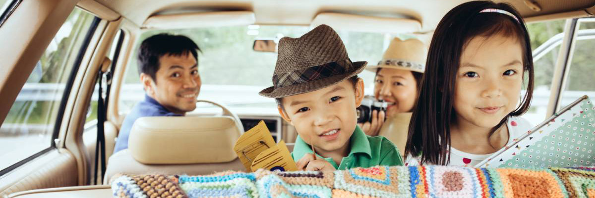 Kids are smiling in the car; image used for HSBC Insurance ValueTerm.