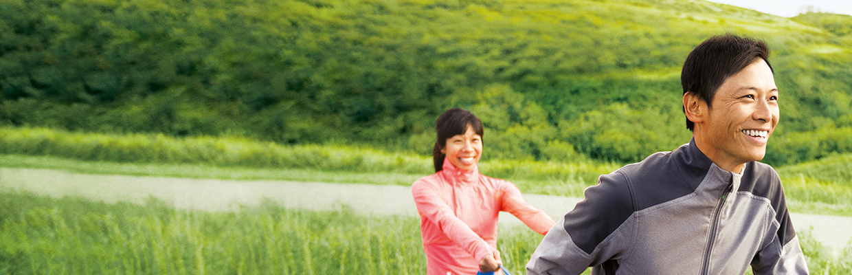 A woman runs after a man; image used for HSBC ValueLife Insurance.